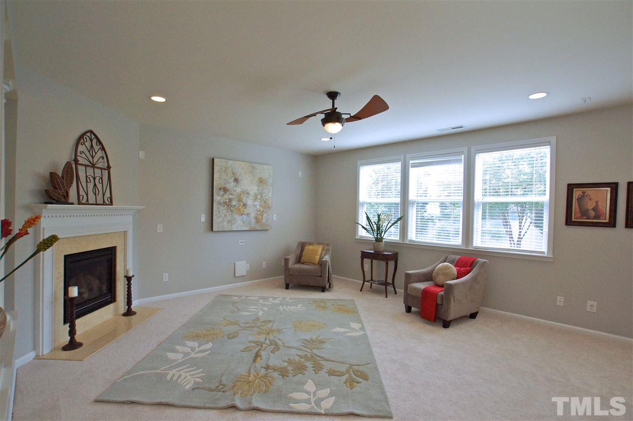 509 Front Ridge Drive Cary, NC 27519 - Photo 8 of 30 a living room with furniture and a fireplace