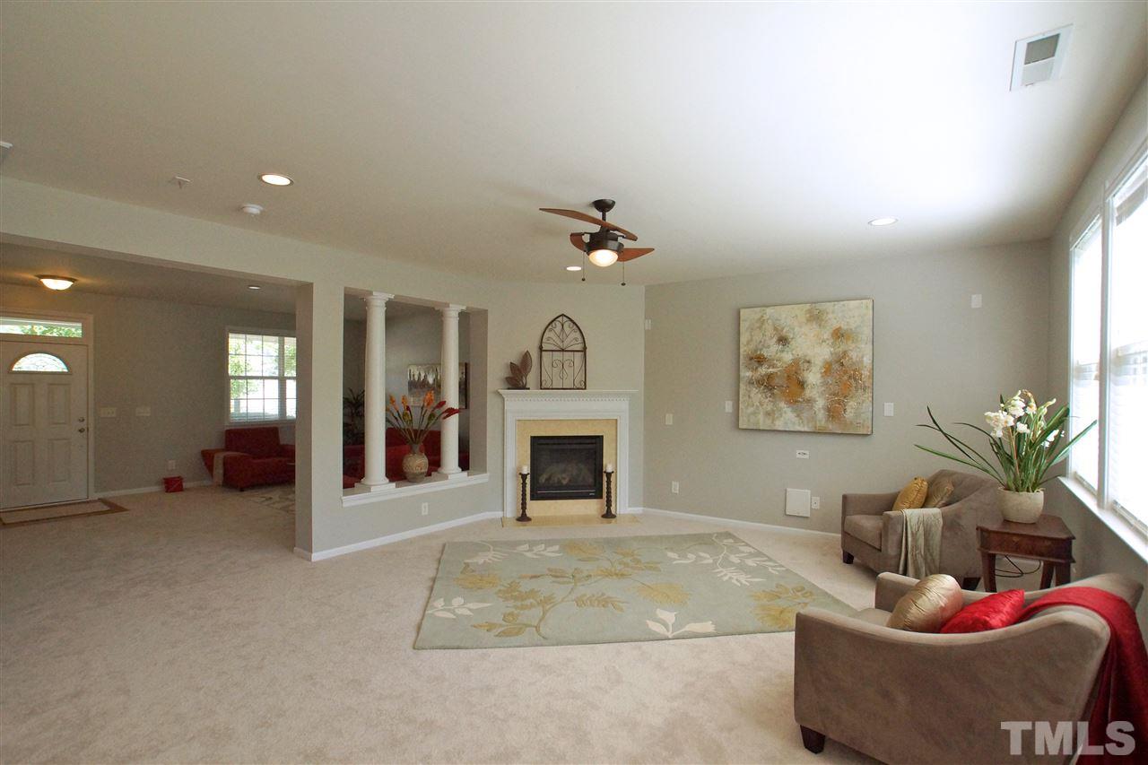 509 Front Ridge Drive Cary, NC 27519 - Photo 10 of 30 a living room with furniture and a fireplace