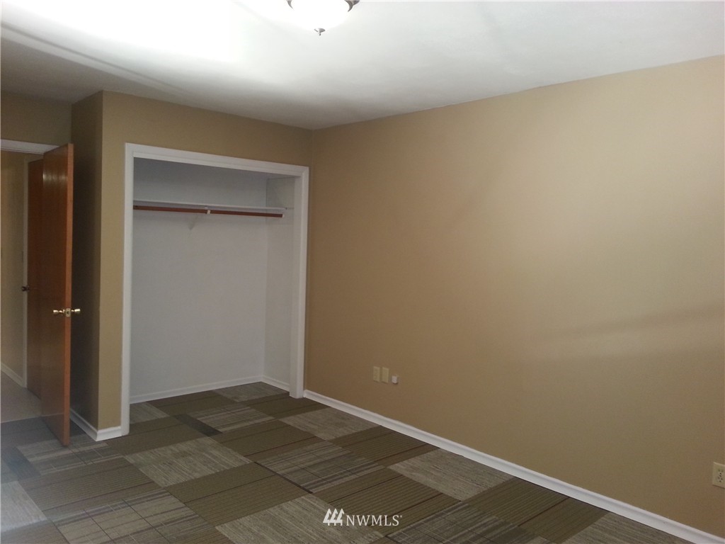 207 Silverbrook Road Randle, WA 98377 - Photo 5 of 10 an empty room with a wooden door