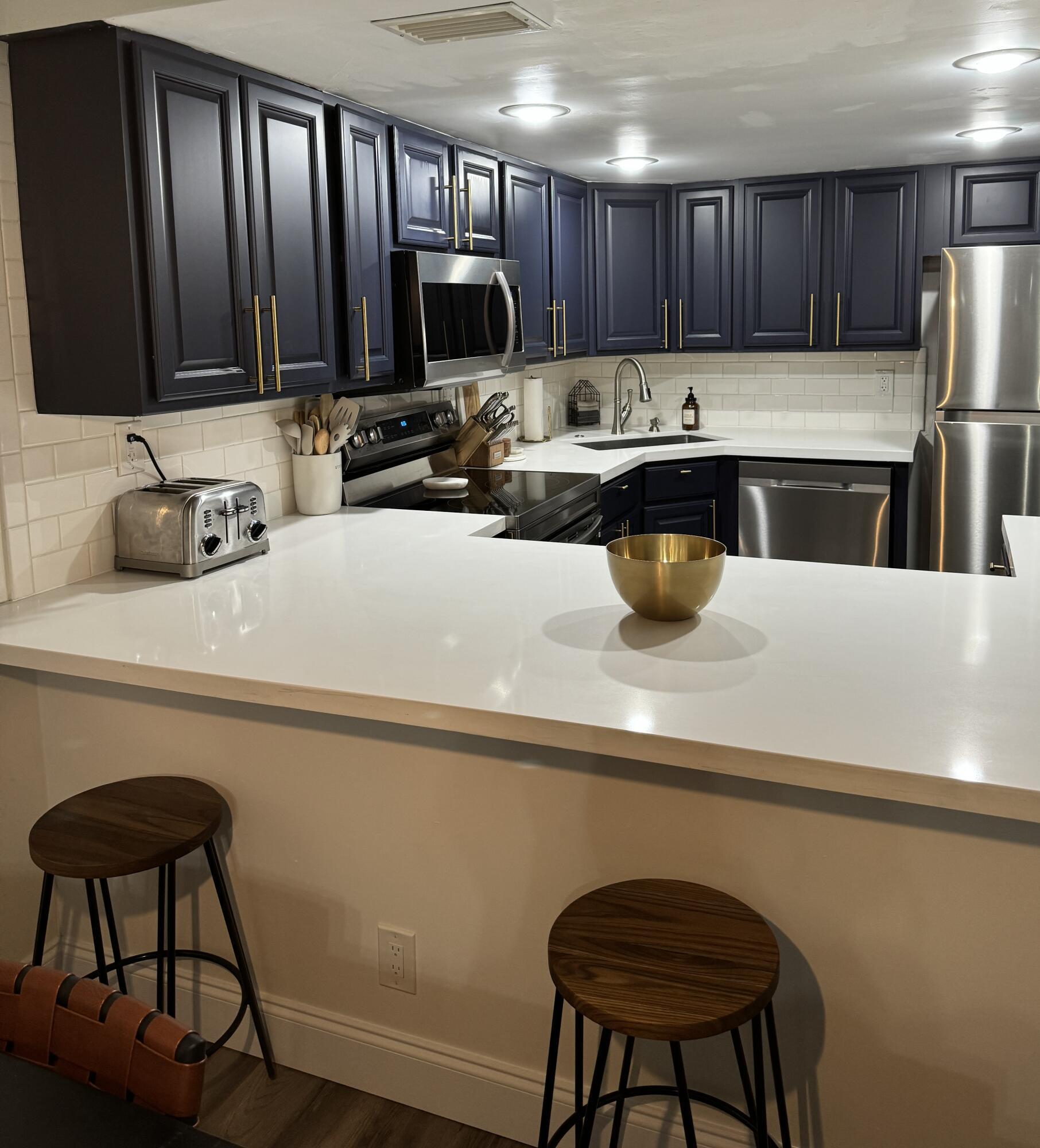 4601 Northwest 2nd Avenue, Unit 805 Boca Raton, FL 33431 - Photo 11 of 34 kitchen w large counter space and bar