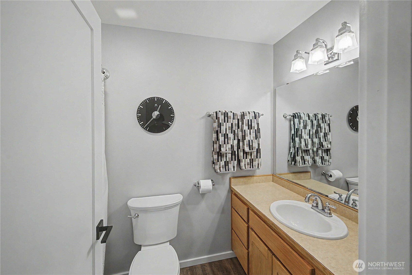 20919 Ronning Road Arlington, WA 98223 - Photo 20 of 28 a bathroom with a toilet sink and mirror