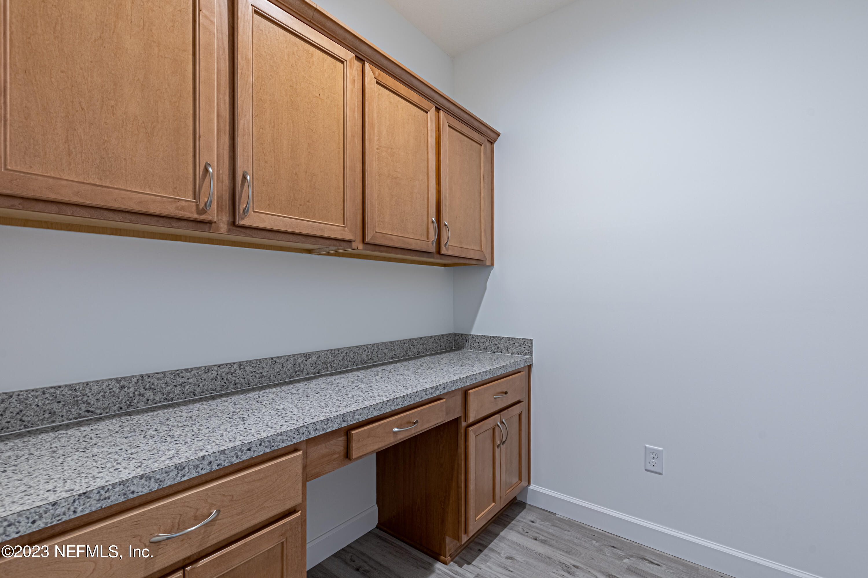 3093 Orange Picker Road Jacksonville, FL 32223 - Photo 11 of 39 a view of cabinets with wooden floor