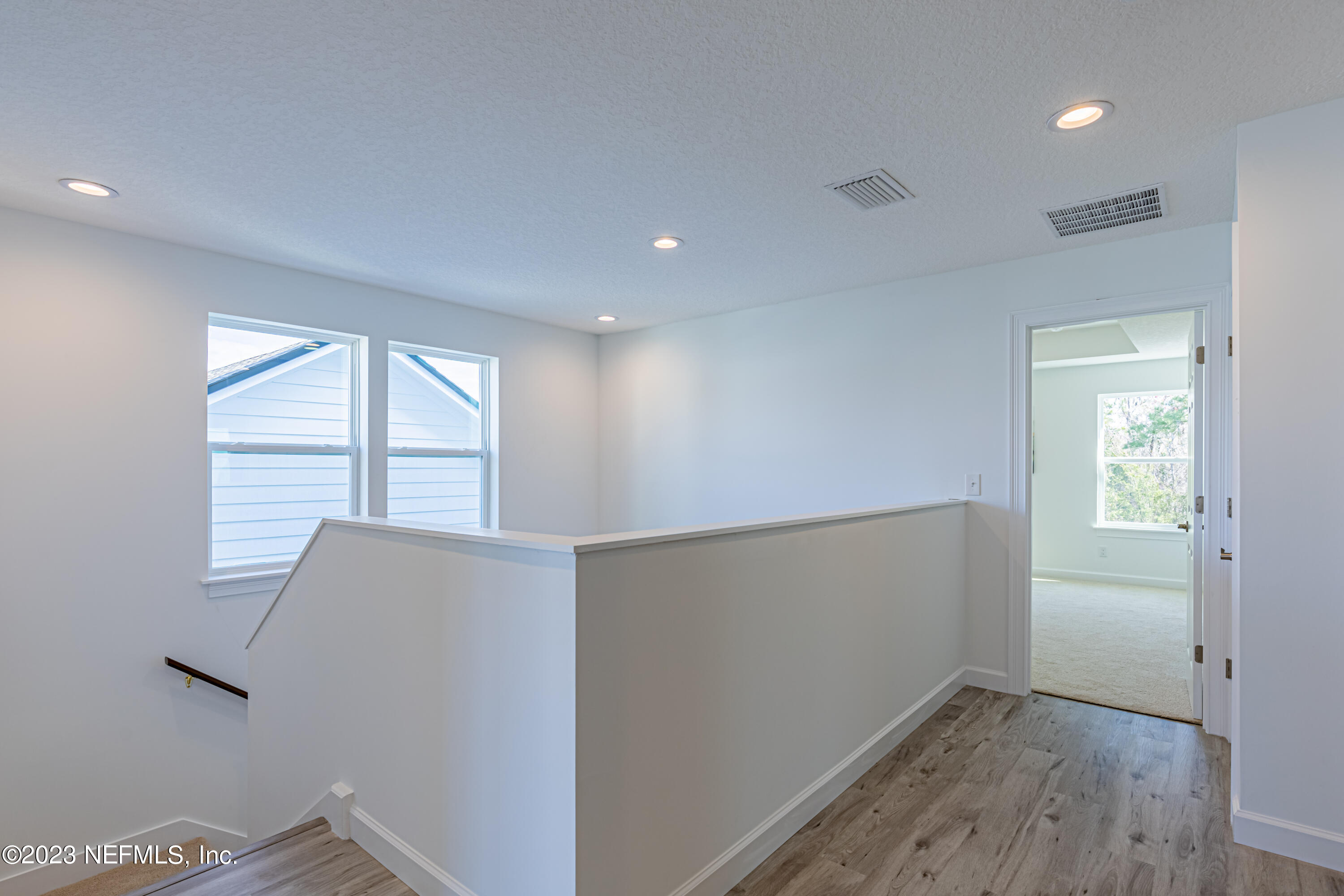 3093 Orange Picker Road Jacksonville, FL 32223 - Photo 21 of 39 a view of room with window and wooden floor