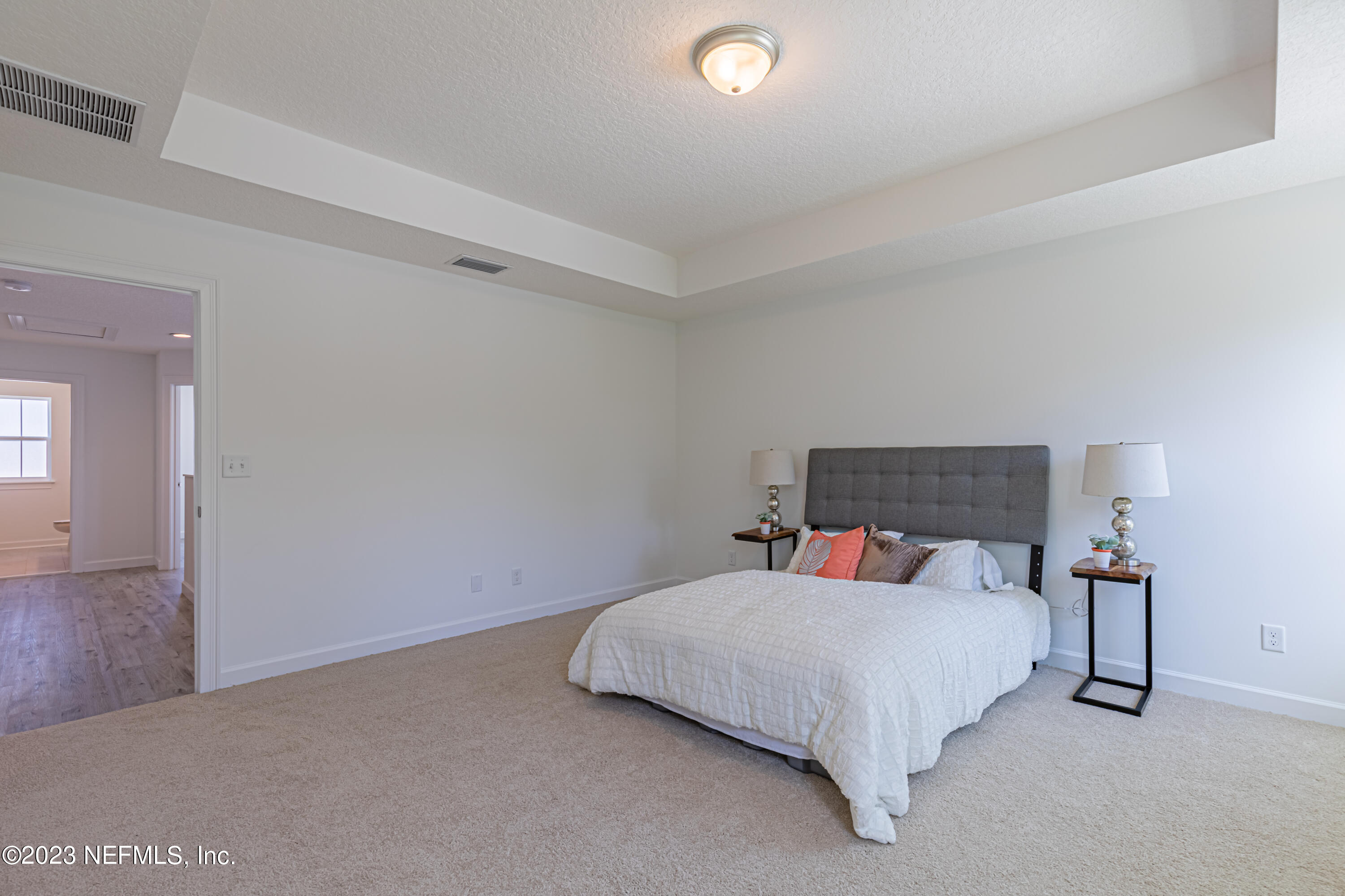 3093 Orange Picker Road Jacksonville, FL 32223 - Photo 25 of 39 a bedroom with a bed and closet