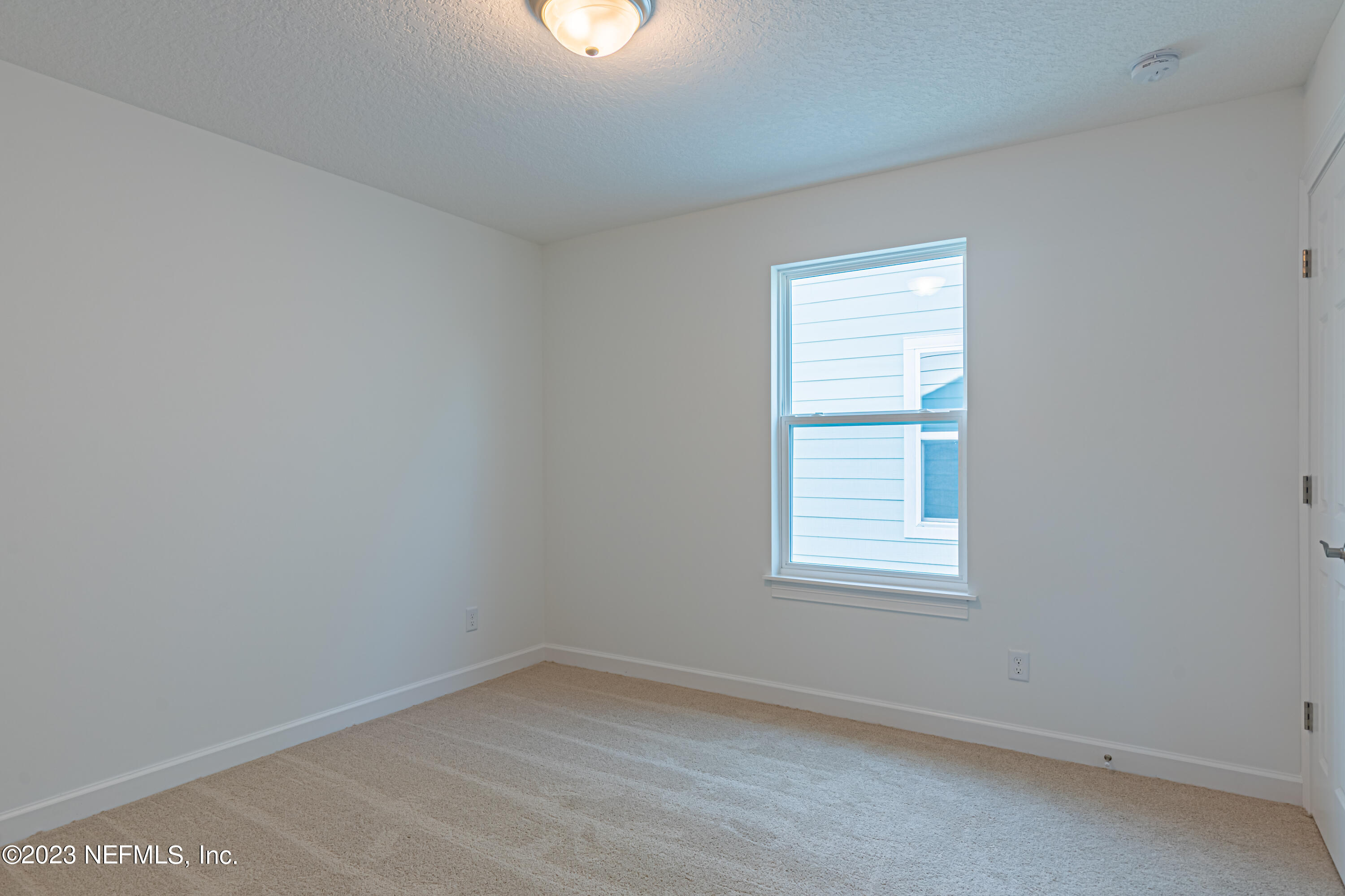 3093 Orange Picker Road Jacksonville, FL 32223 - Photo 29 of 39 an empty room with a window