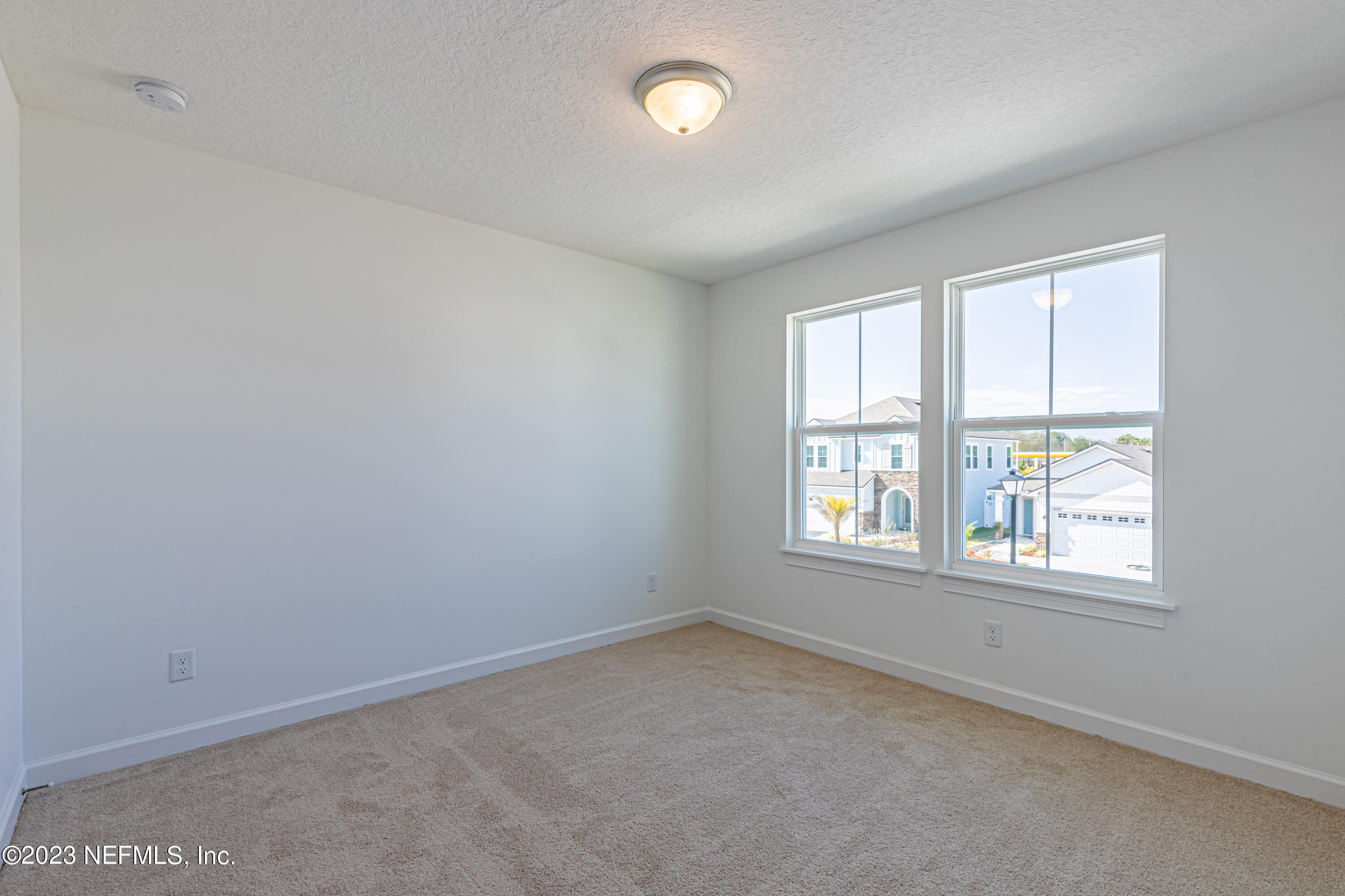 3093 Orange Picker Road Jacksonville, FL 32223 - Photo 30 of 39 an empty room with a window