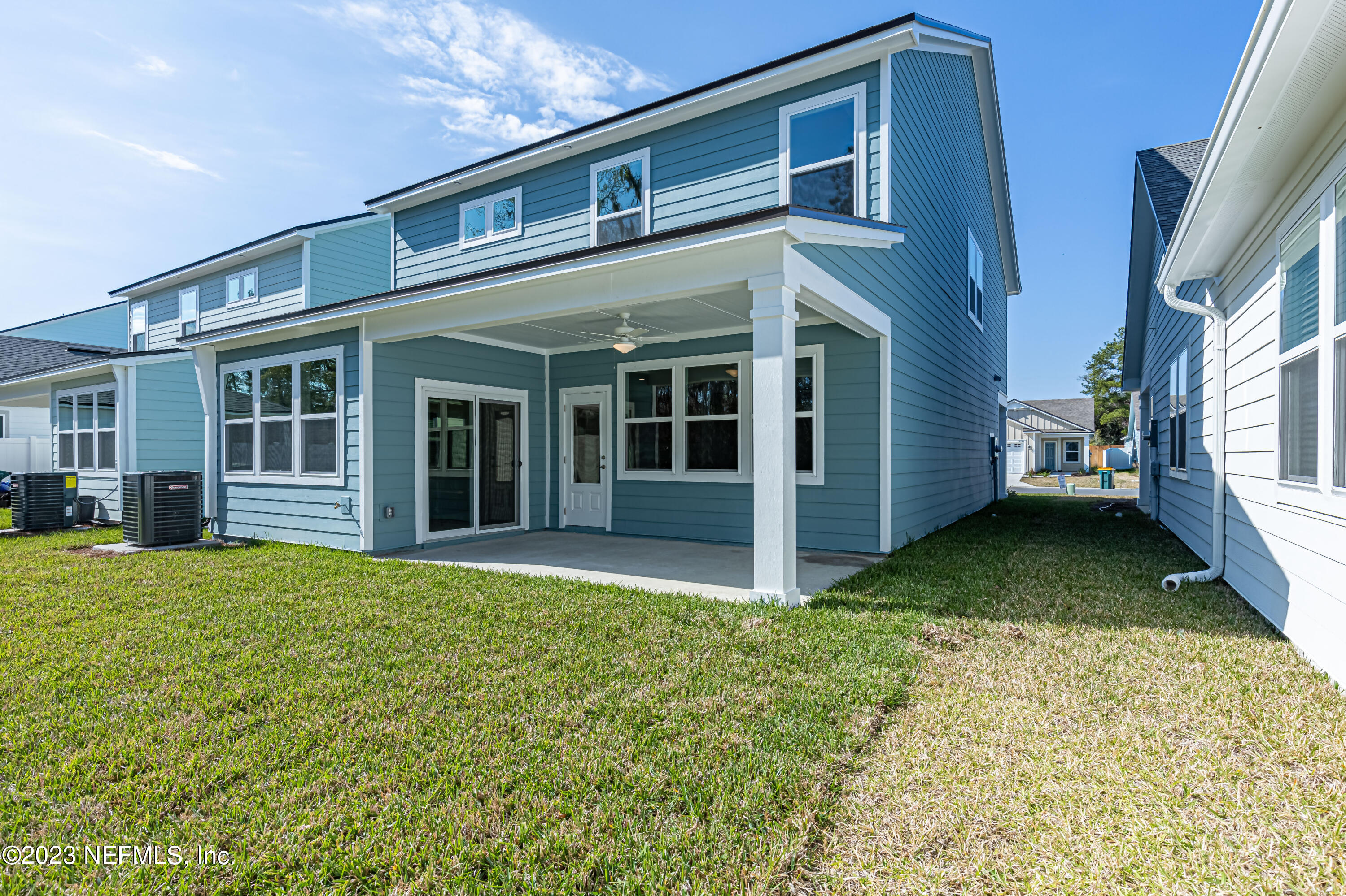 3093 Orange Picker Road Jacksonville, FL 32223 - Photo 36 of 39 a view of a house with a yard