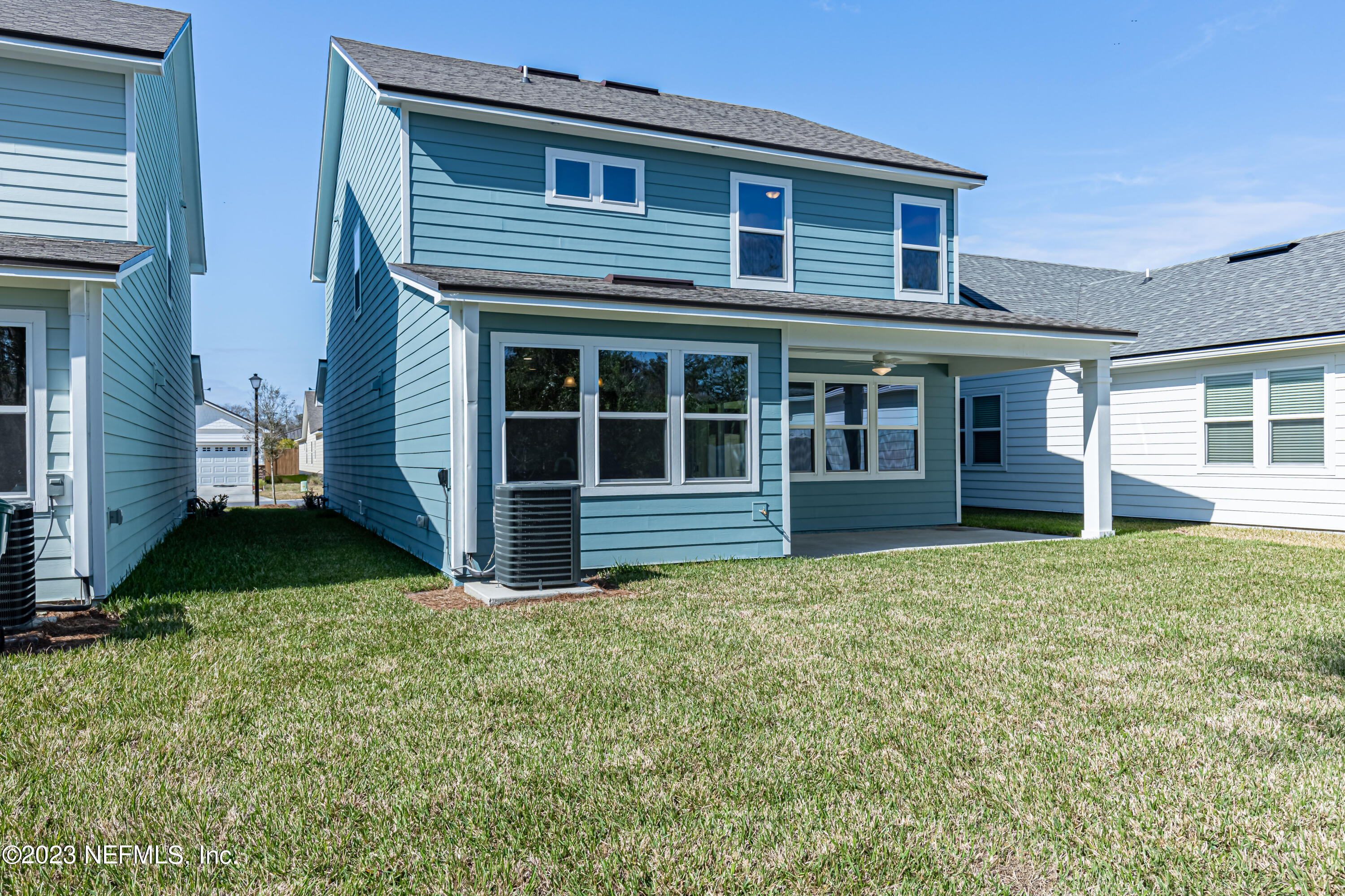 3093 Orange Picker Road Jacksonville, FL 32223 - Photo 38 of 39 a view of a house with a yard