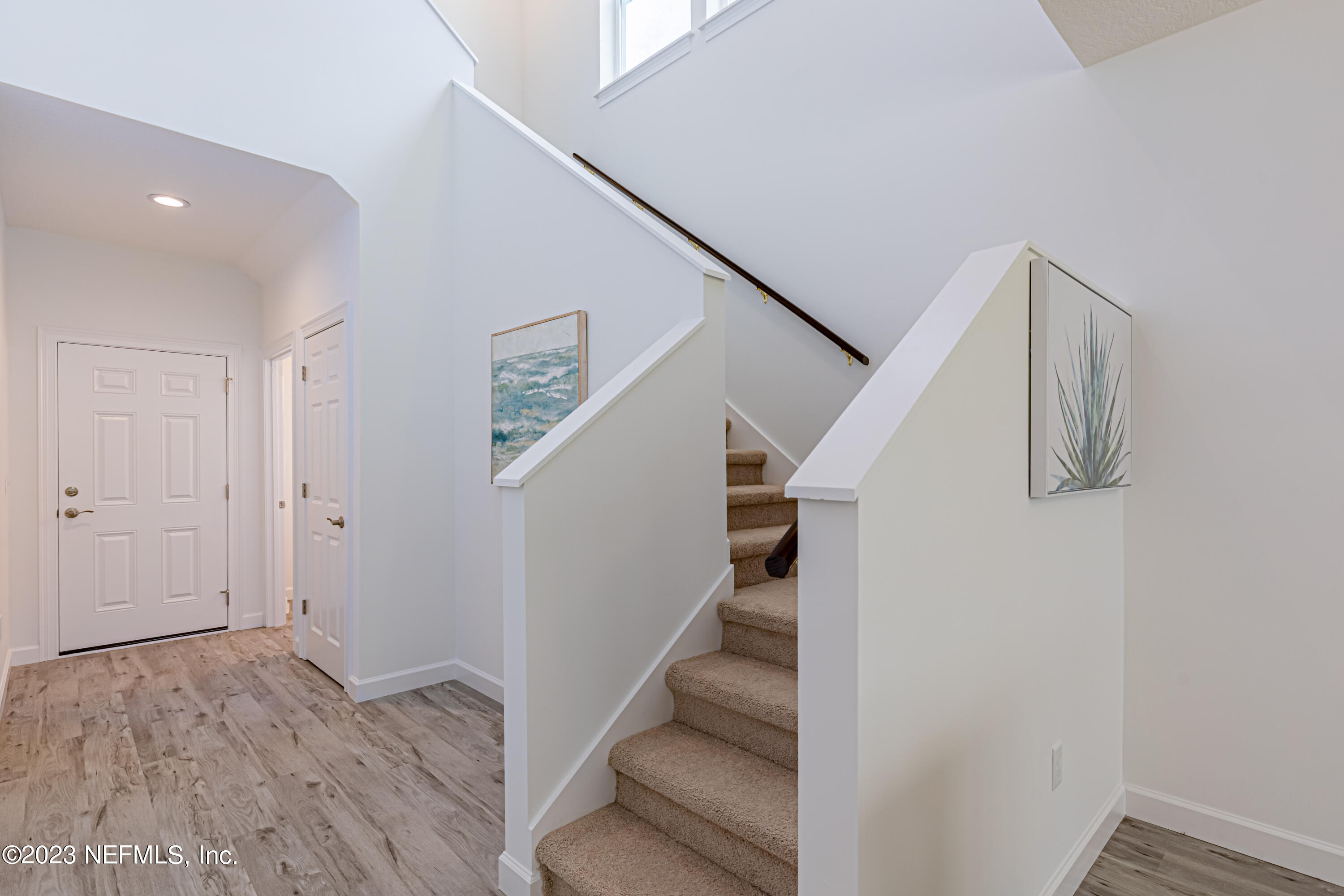 3093 Orange Picker Road Jacksonville, FL 32223 - Photo 4 of 39 a view of entryway and hall with wooden floor