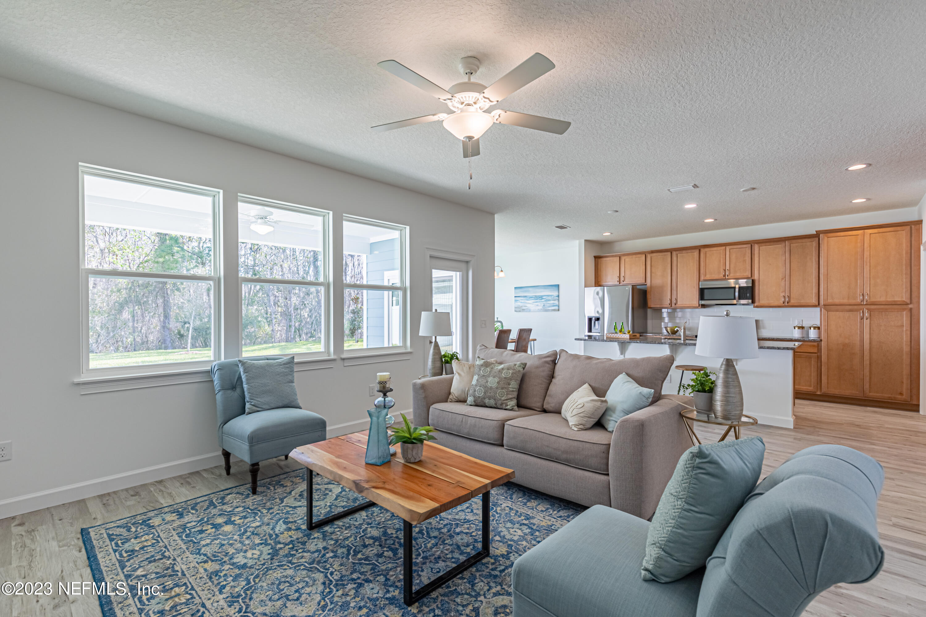 3093 Orange Picker Road Jacksonville, FL 32223 - Photo 6 of 39 a living room with furniture and a window