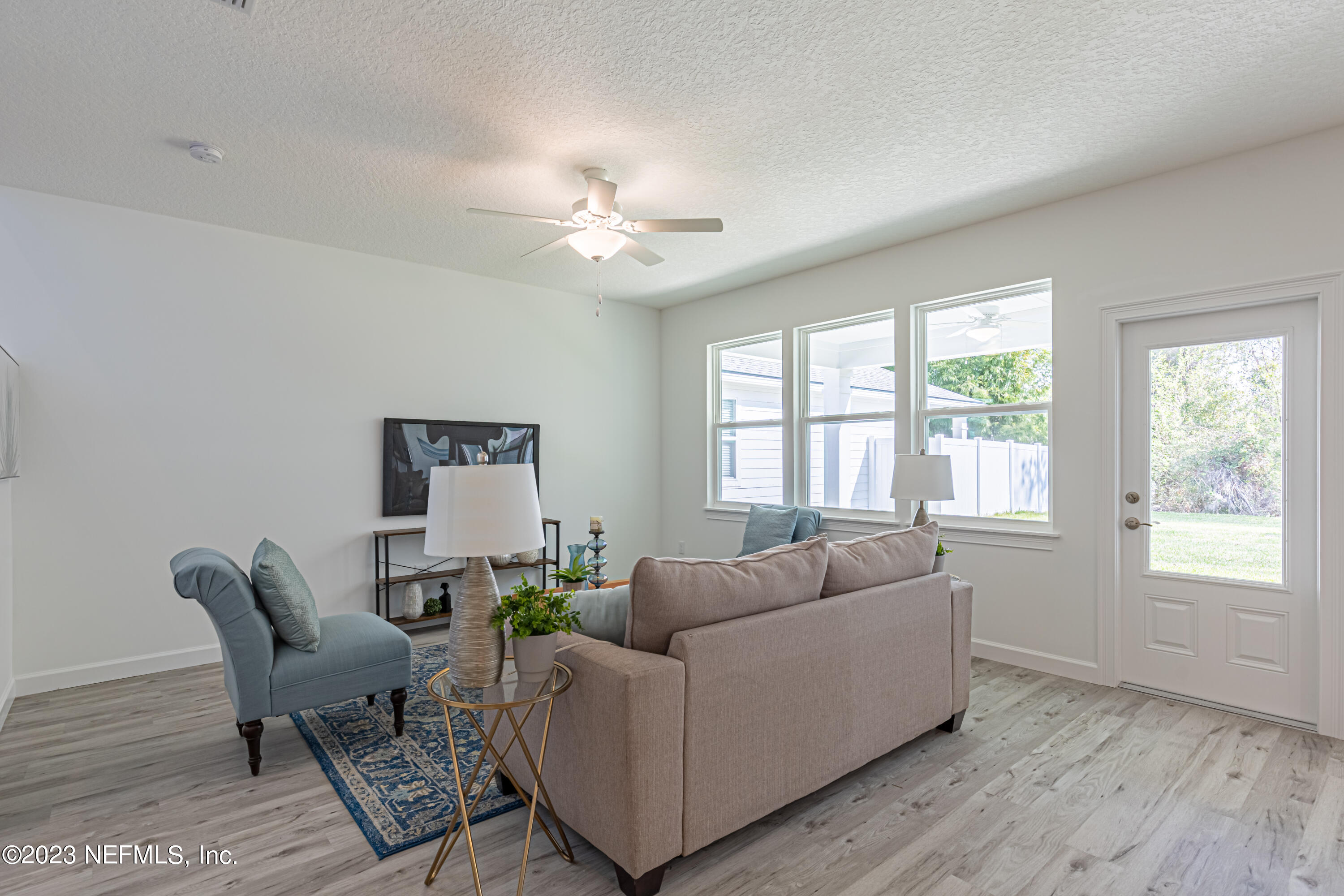 3093 Orange Picker Road Jacksonville, FL 32223 - Photo 9 of 39 a living room with furniture and a window