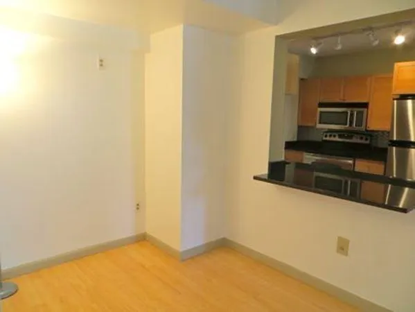 a view of a kitchen from the hallway