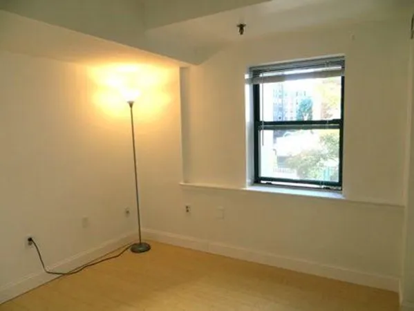 a view of an empty room and window