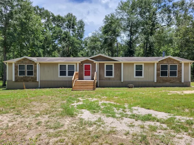 a house view with a garden space