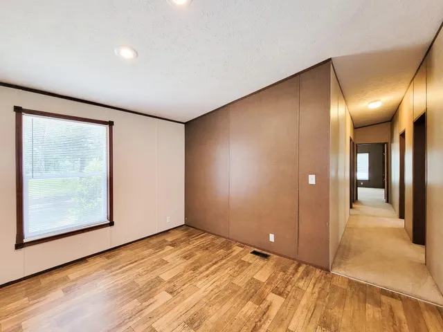 a view of kitchen with kitchen island microwave and stove refrigerator
