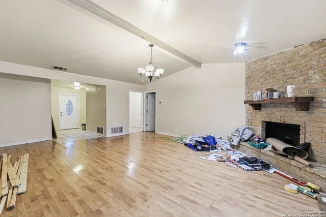 a view of a livingroom with wooden floor