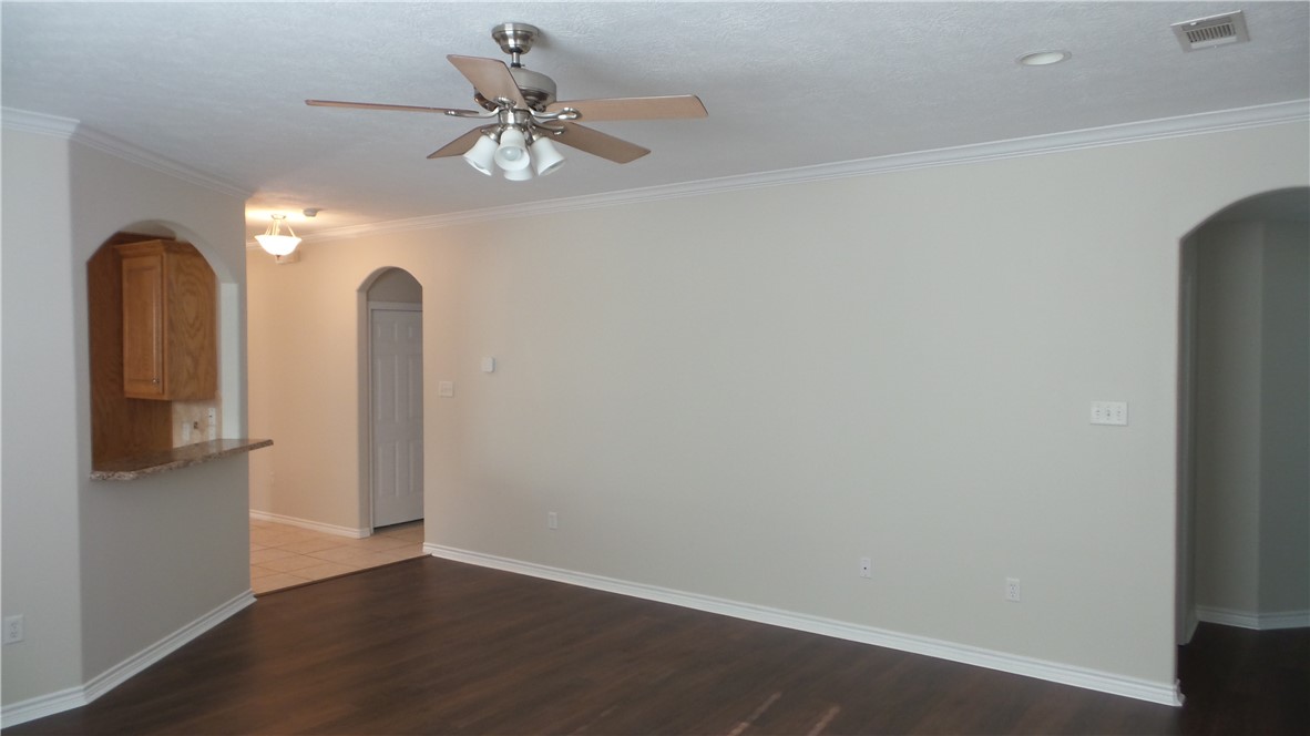 114 Rugen Lane College Station, TX 77845 - Photo 3 of 22 wooden floor in an empty room with a window