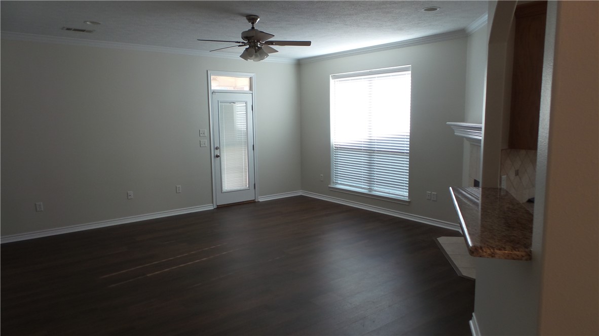 114 Rugen Lane College Station, TX 77845 - Photo 5 of 22 an empty room with wooden floor and windows