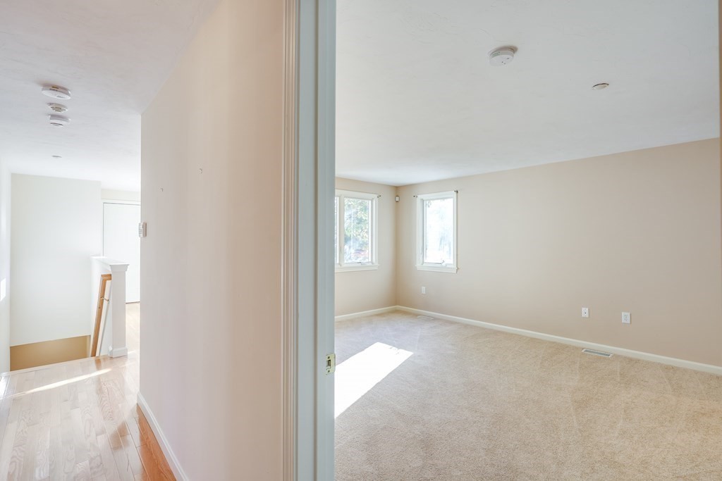 16 North Ridge Road, Unit 16 Mashpee, MA 02649 - Photo 20 of 42 a view of an empty room and window