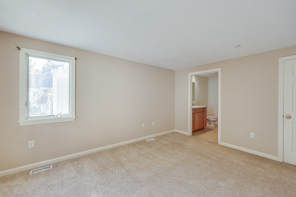 16 North Ridge Road, Unit 16 Mashpee, MA 02649 - Photo 22 of 42 a view of an empty room with a window