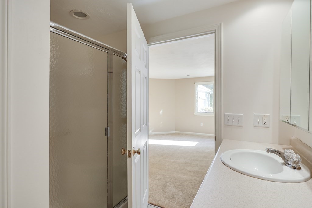 16 North Ridge Road, Unit 16 Mashpee, MA 02649 - Photo 25 of 42 a bathroom with a shower and a sink