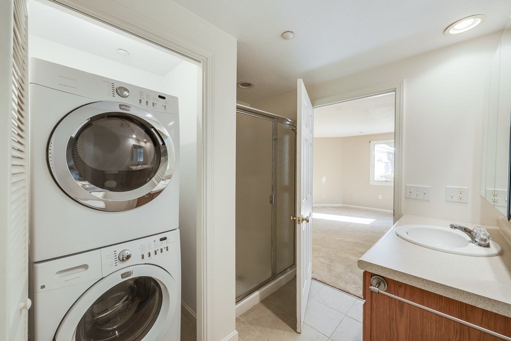 16 North Ridge Road, Unit 16 Mashpee, MA 02649 - Photo 27 of 42 a view of a bathroom with washing machine and washer