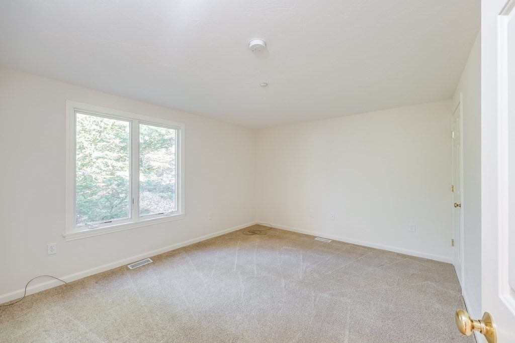 16 North Ridge Road, Unit 16 Mashpee, MA 02649 - Photo 28 of 42 an empty room with a window