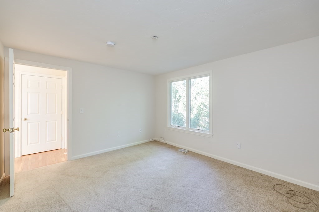 16 North Ridge Road, Unit 16 Mashpee, MA 02649 - Photo 29 of 42 a view of an empty room with a window