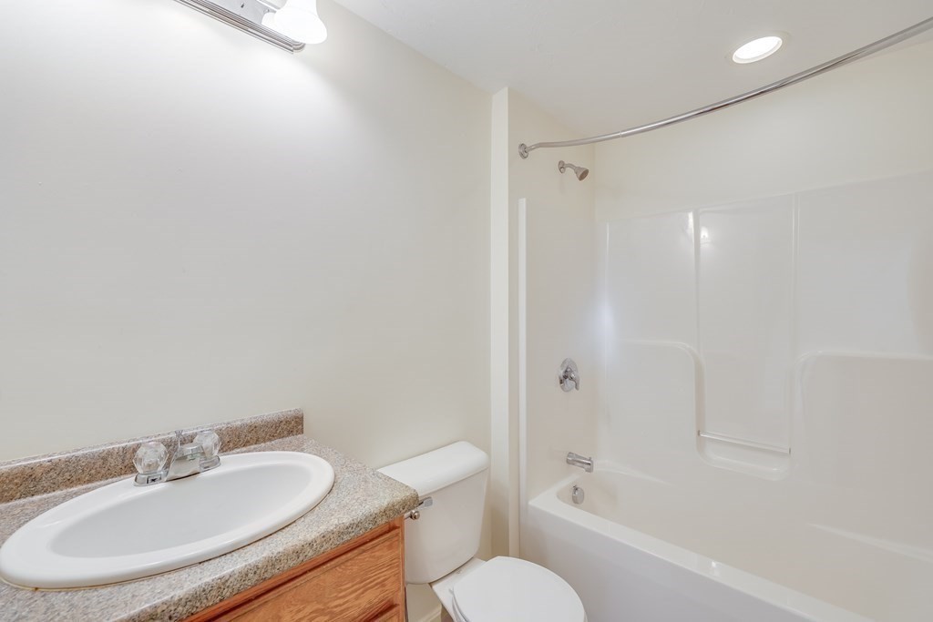 16 North Ridge Road, Unit 16 Mashpee, MA 02649 - Photo 30 of 42 a bathroom with a sink toilet and shower