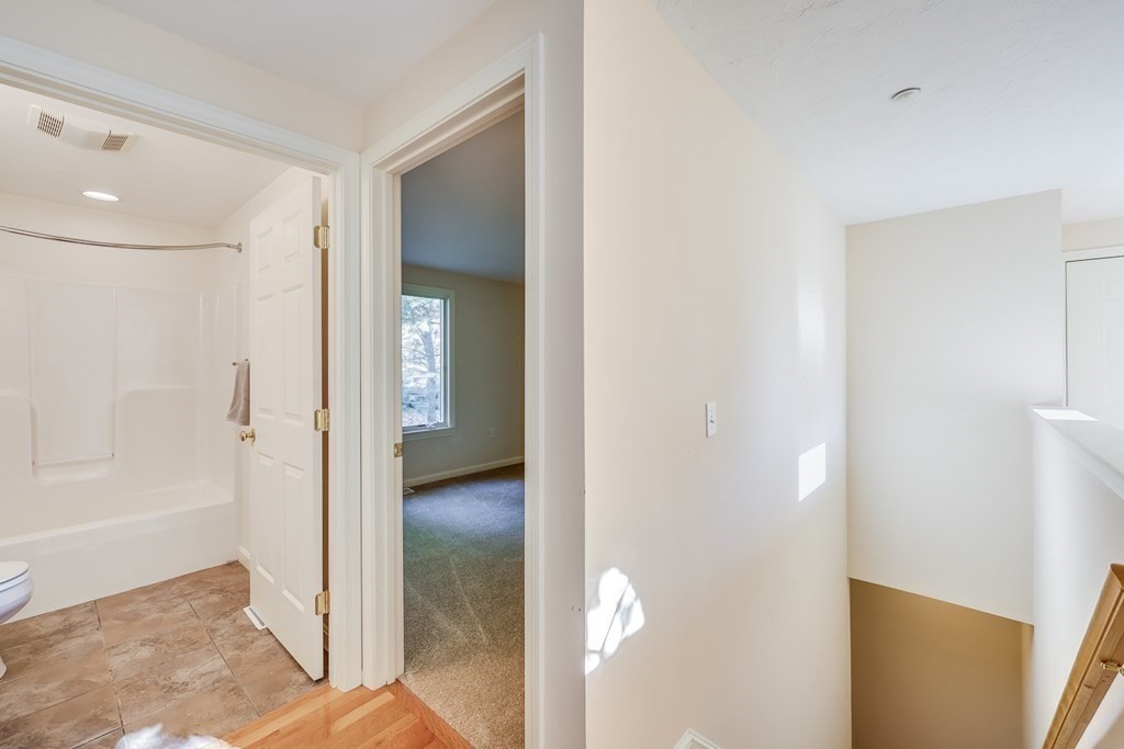 16 North Ridge Road, Unit 16 Mashpee, MA 02649 - Photo 31 of 42 a view of a bathroom with a shower and a sink