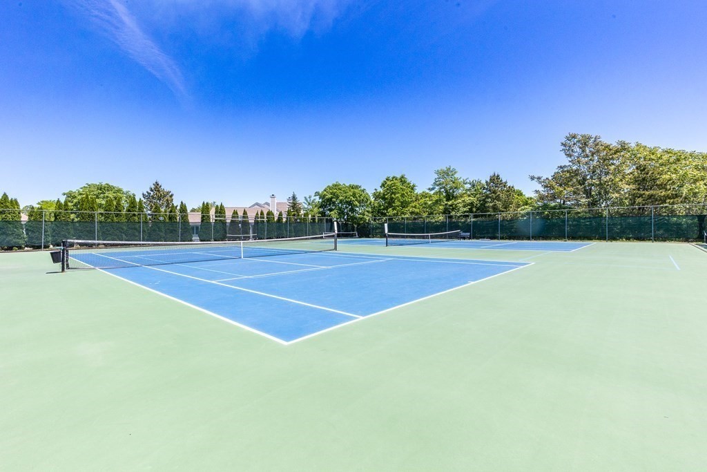 16 North Ridge Road, Unit 16 Mashpee, MA 02649 - Photo 38 of 42 a view of tennis court with trees in the background