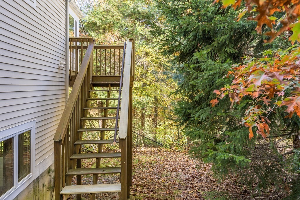 16 North Ridge Road, Unit 16 Mashpee, MA 02649 - Photo 5 of 42 a view of a large building with a tree