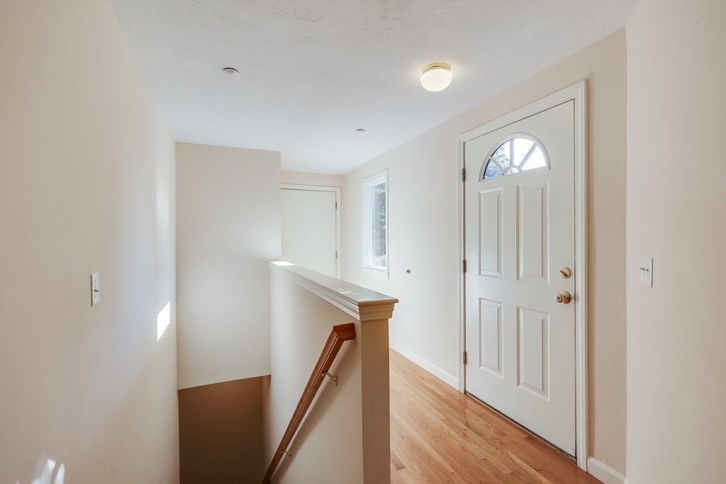 16 North Ridge Road, Unit 16 Mashpee, MA 02649 - Photo 8 of 42 a view of a hallway with entryway to rooms