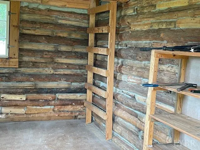 a backyard of a house with barbeque oven and yard