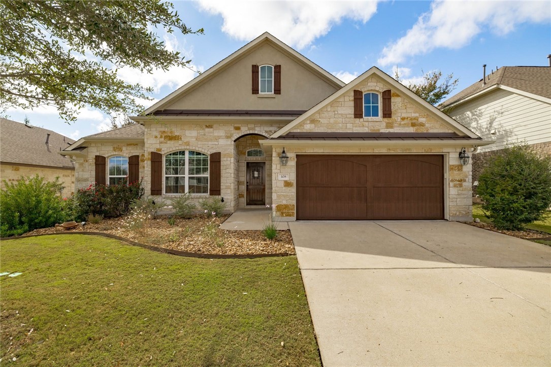 108 San Matteo Street Georgetown, TX 78628 - Photo 1 of 1 a front view of a house with garden