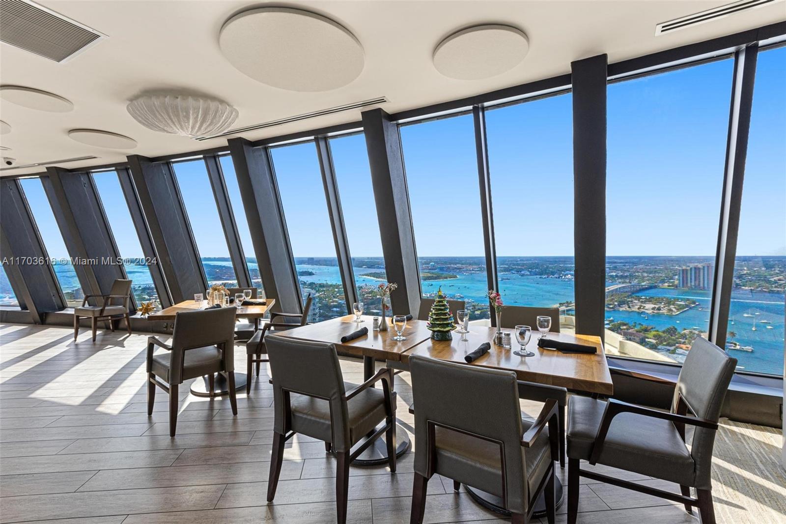 3000 North Ocean Drive, Unit 24H Riviera Beach, FL 33404 - Photo 20 of 33 a view of a dining room with furniture window and wooden floor