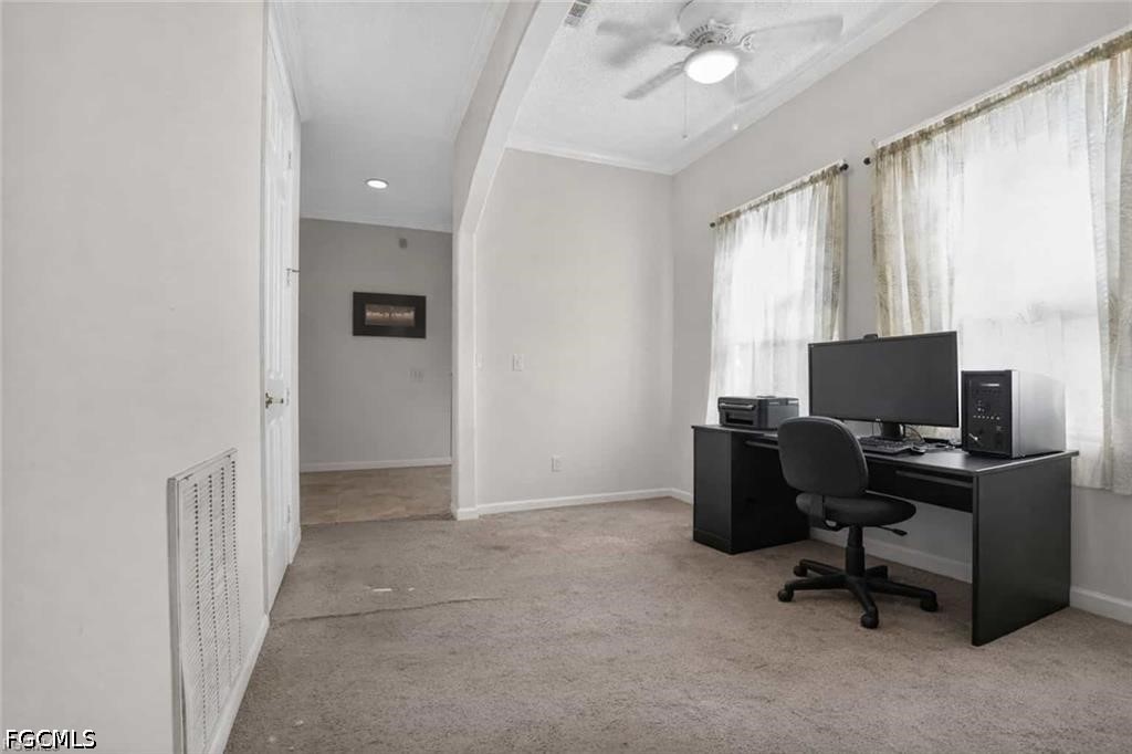 2808 34th Street Southwest Lehigh Acres, FL 33976 - Photo 13 of 14 a view of a livingroom with workspace and a window