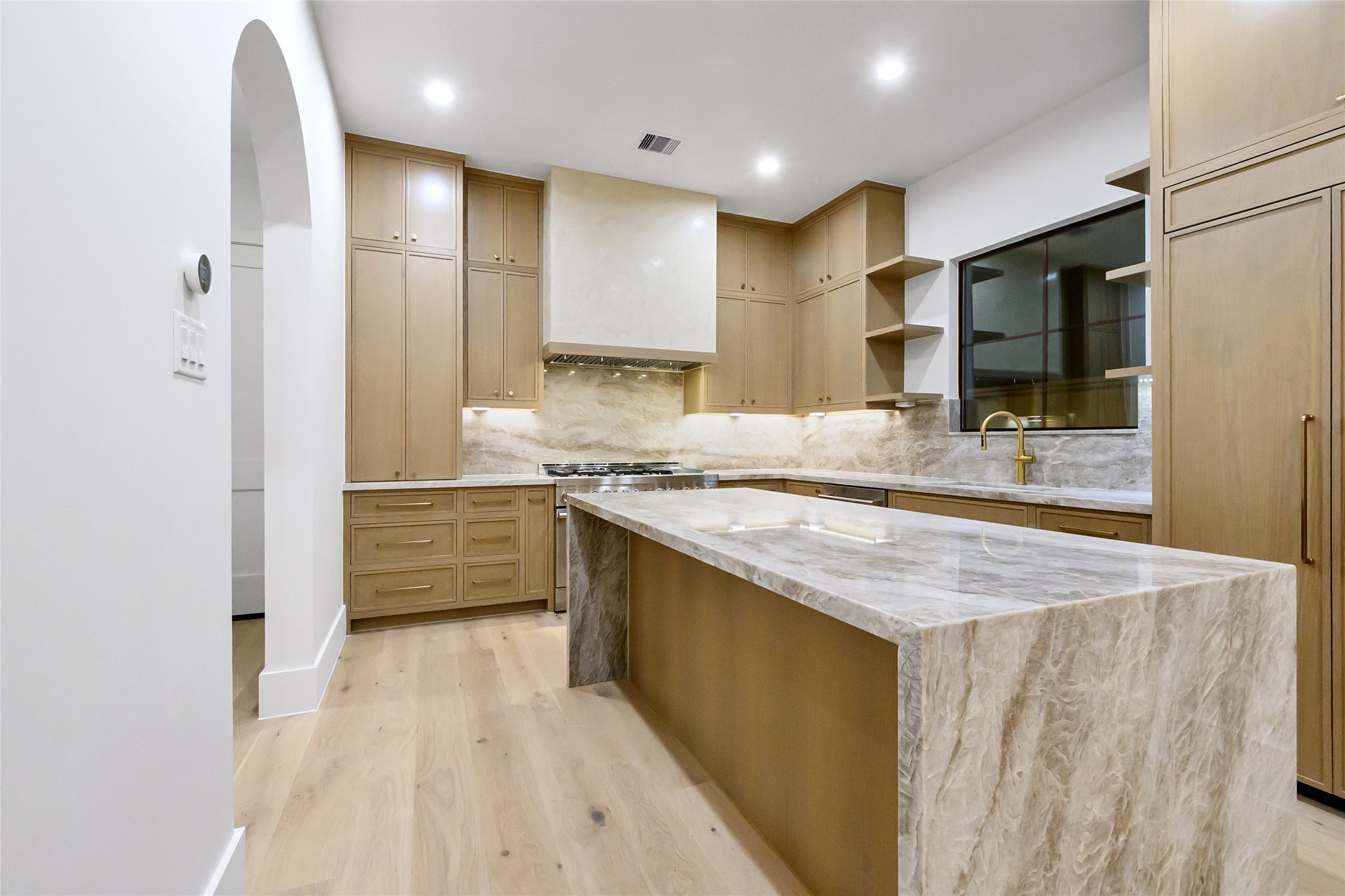 112 East 27th Street Houston, TX 77008 - Photo 32 of 43 a kitchen with stainless steel appliances kitchen island granite countertop a sink and cabinets