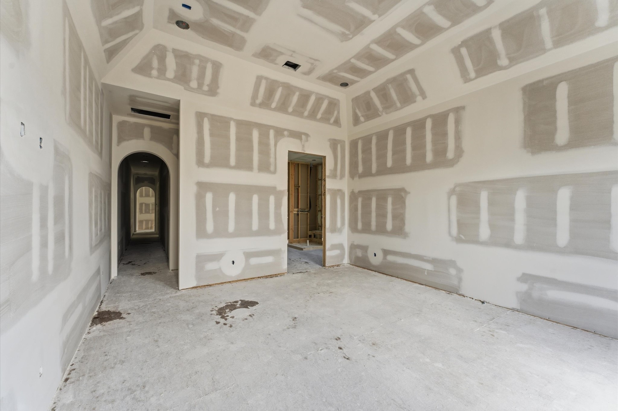 112 East 27th Street Houston, TX 77008 - Photo 13 of 43 Vaulted ceilings open up the space in the primary bedroom.
