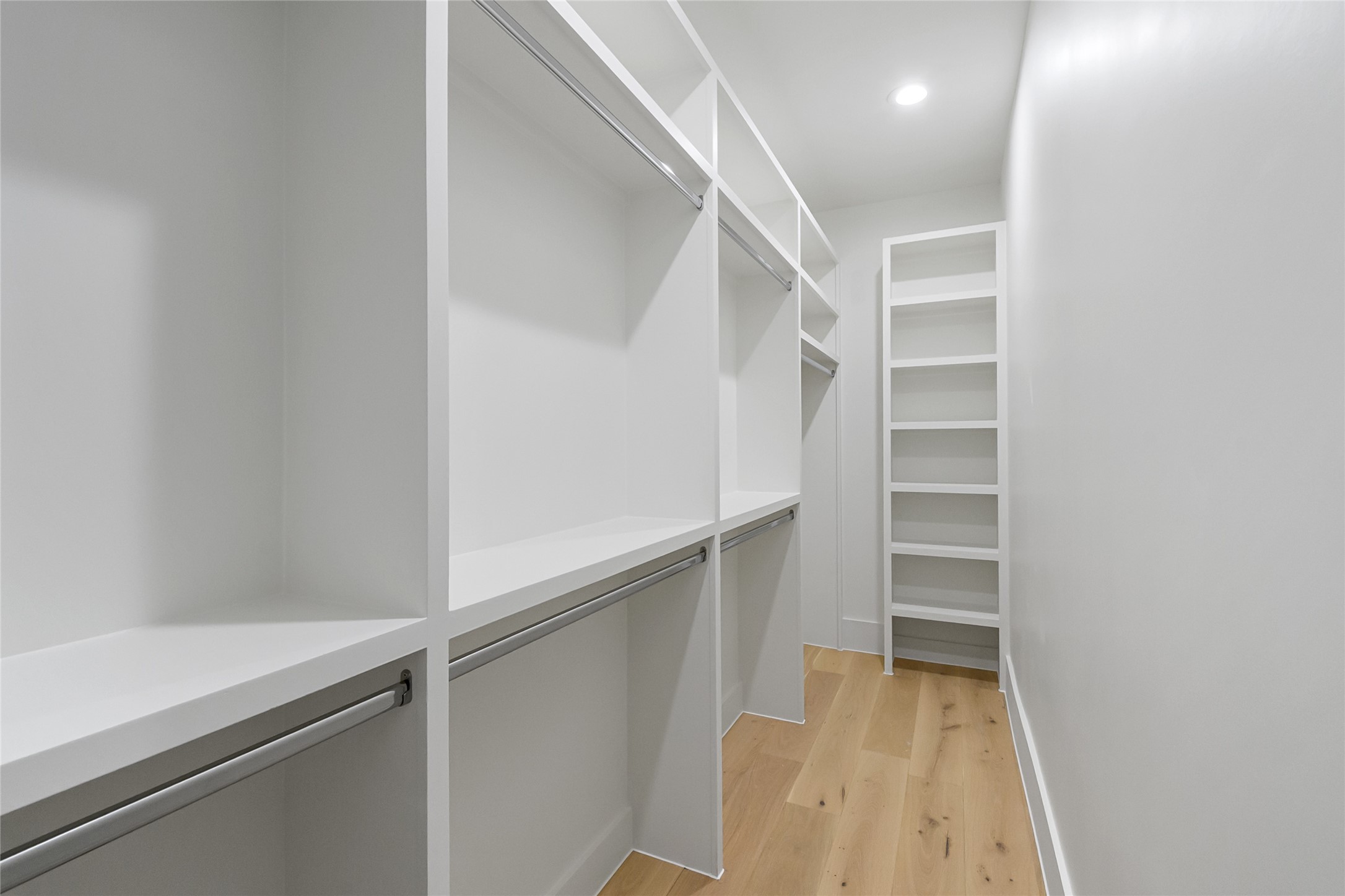 112 East 27th Street Houston, TX 77008 - Photo 36 of 43 a view of walk in closet with empty racks