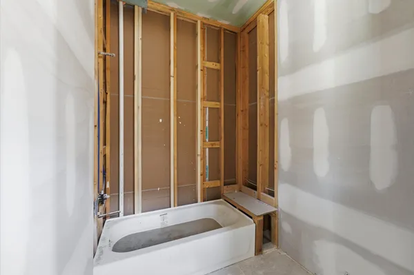 a bathroom with a double vanity sink mirror and shower