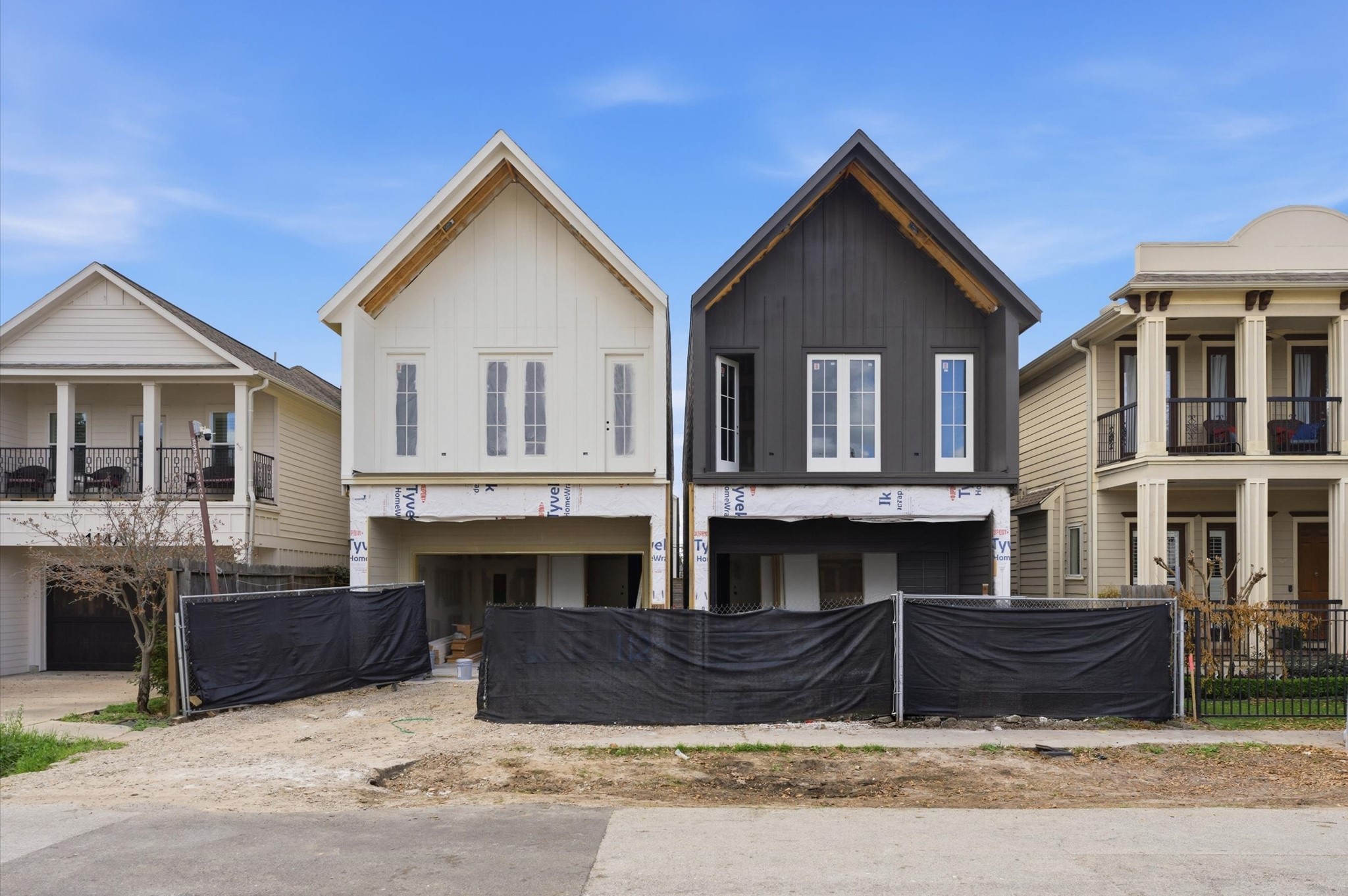 112 East 27th Street Houston, TX 77008 - Photo 2 of 43 a front view of a house with glass windows and a yard