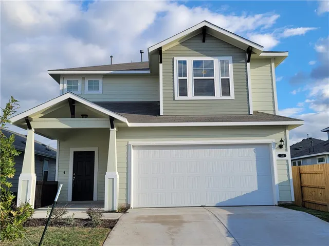 a view of a house with garage