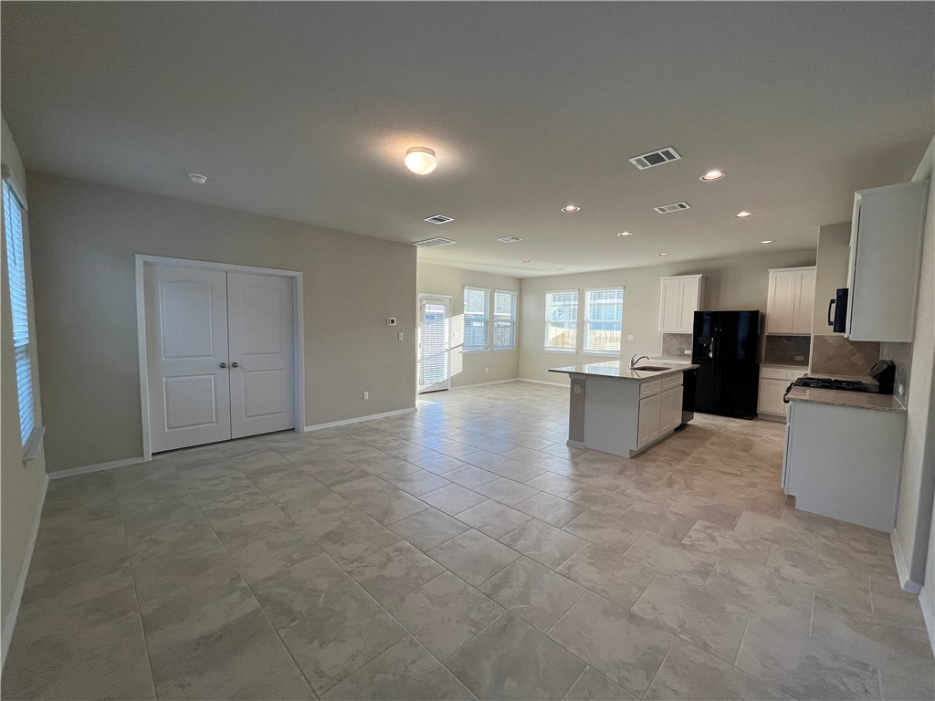 128 Bright Flora Lane Maxwell, TX 78656 - Photo 2 of 14 a view of an empty room with a kitchen