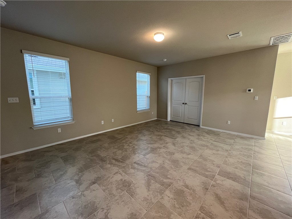 128 Bright Flora Lane Maxwell, TX 78656 - Photo 3 of 14 an empty room with windows