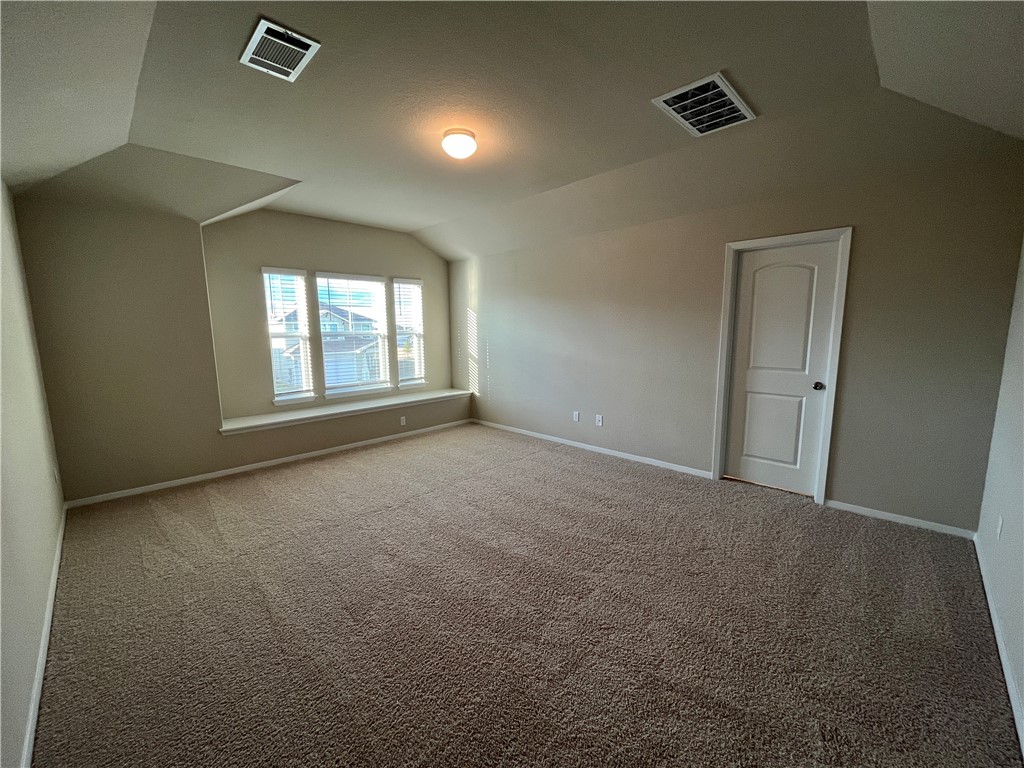 128 Bright Flora Lane Maxwell, TX 78656 - Photo 8 of 14 an empty room with windows and closet