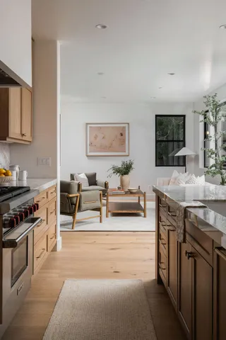 a kitchen with stainless steel appliances granite countertop a stove and a sink