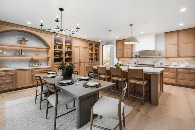 a kitchen with granite countertop a stove a sink and a microwave