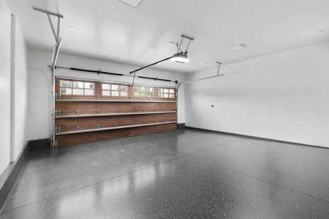 a view of a big house with big yard and large trees