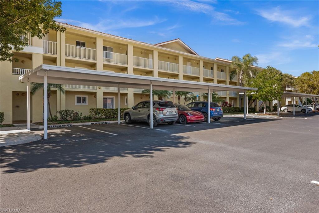 8264 Key Royal Circle, Unit 812 Naples, FL 34119 - Photo 2 of 21 View of covered parking lot